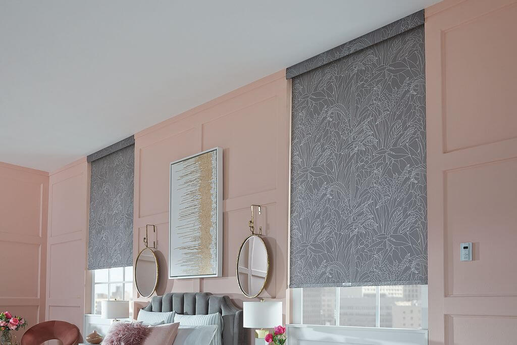 Roller shades in a living room, shown in a stone gray fabric